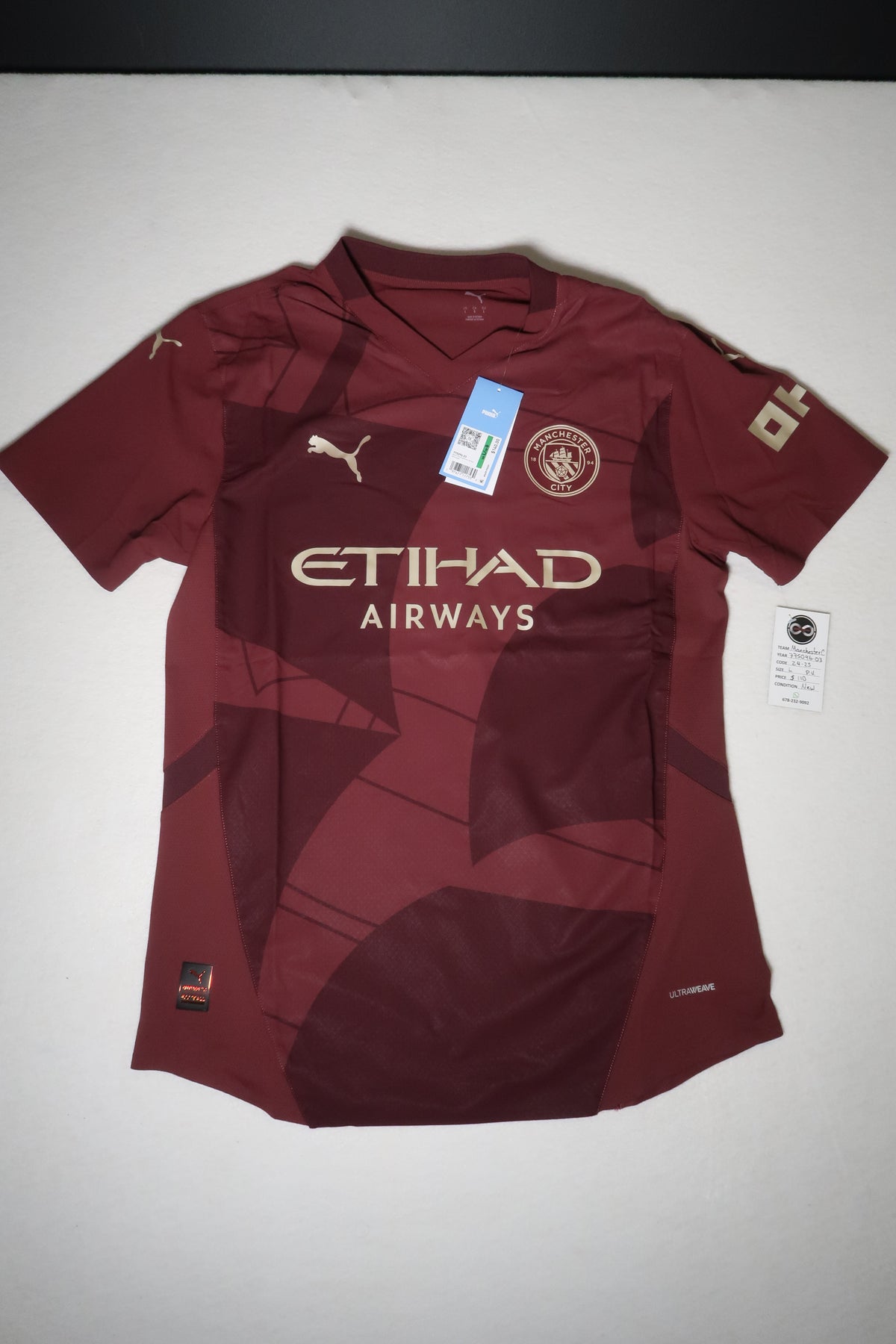 2024-25 Manchester City third jersey front, burgundy with Etihad Airways branding