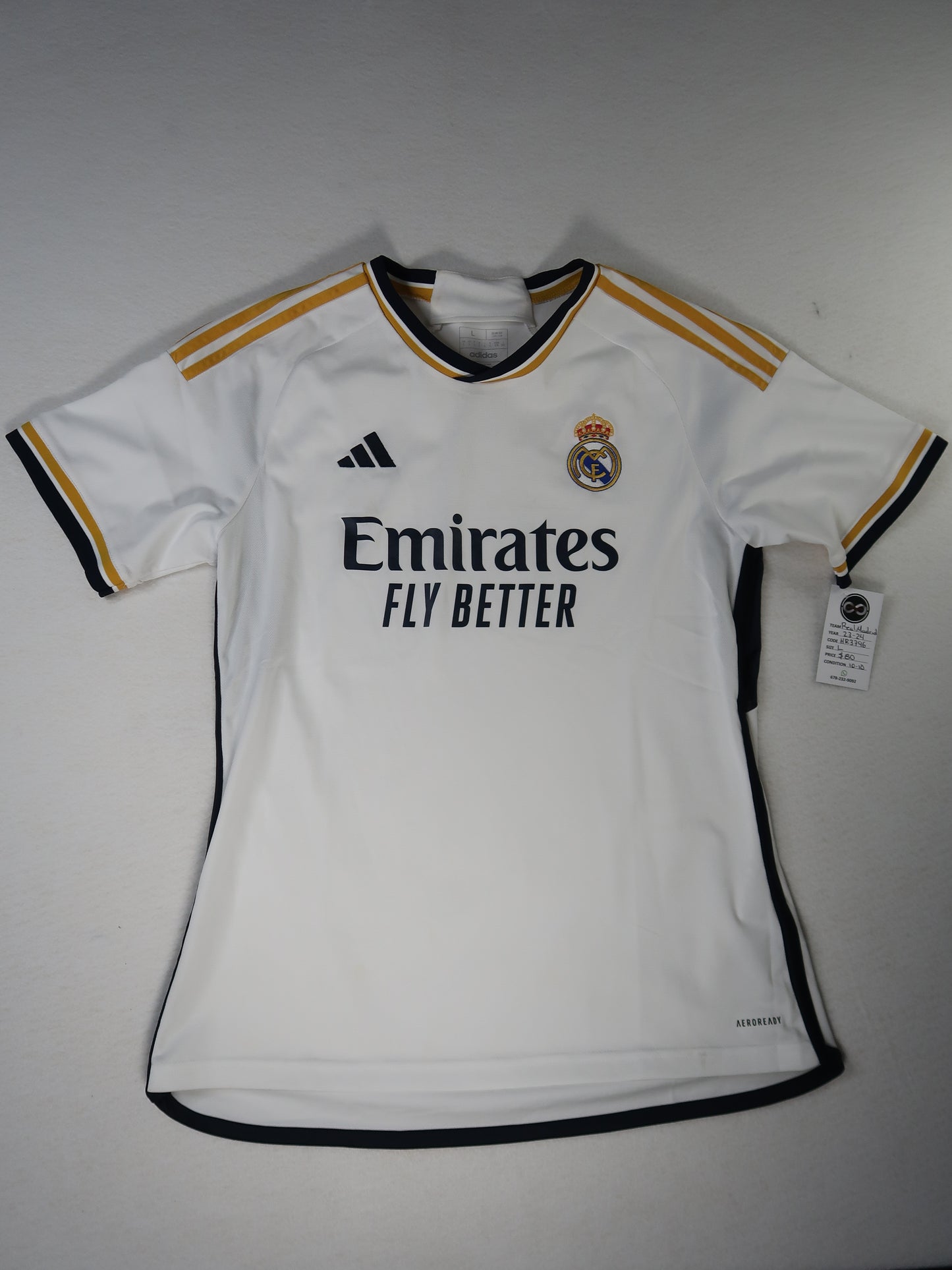 2023-24 Real Madrid home jersey front, white with navy and gold trim