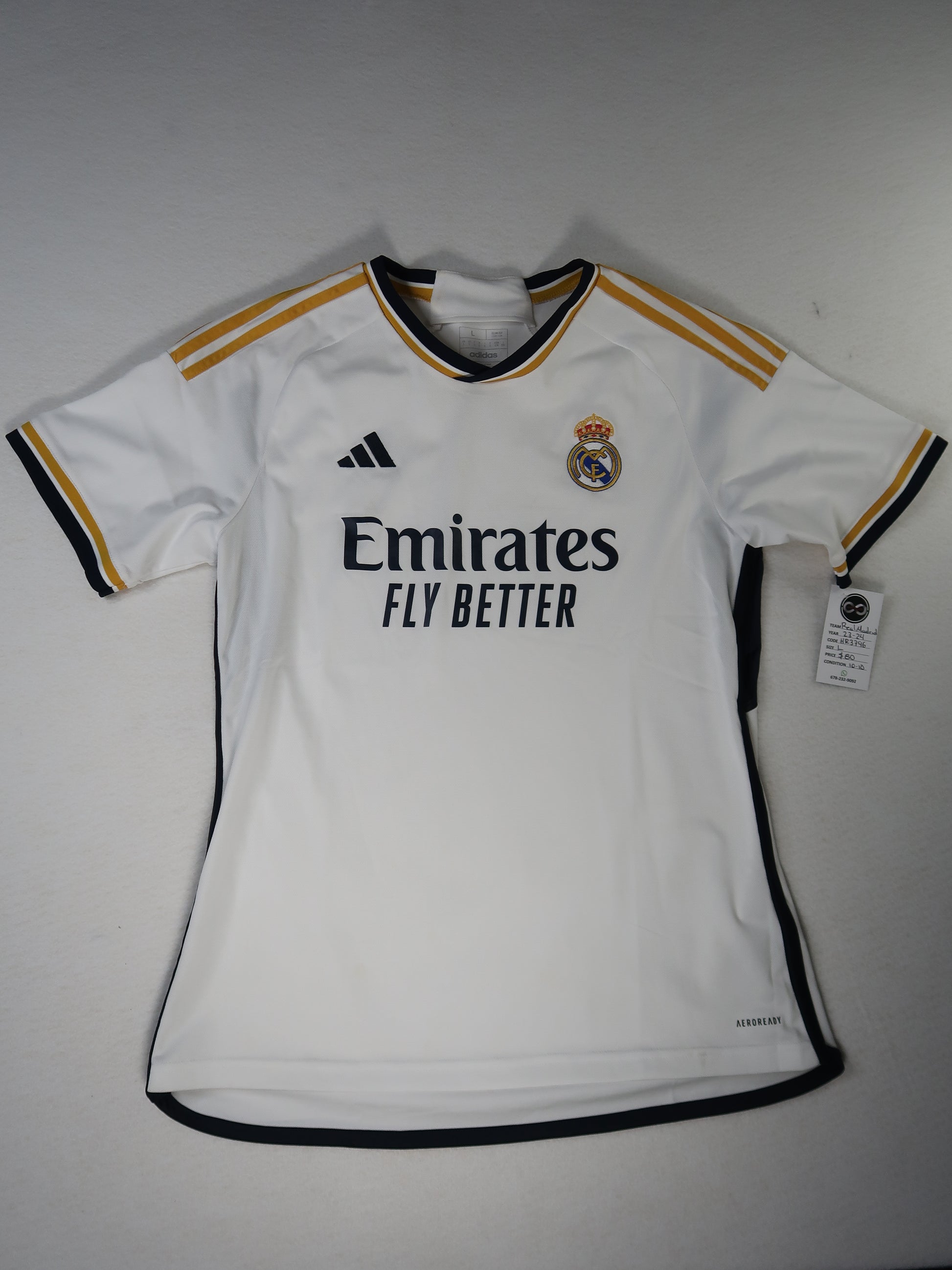 2023-24 Real Madrid home jersey front, white with navy and gold trim