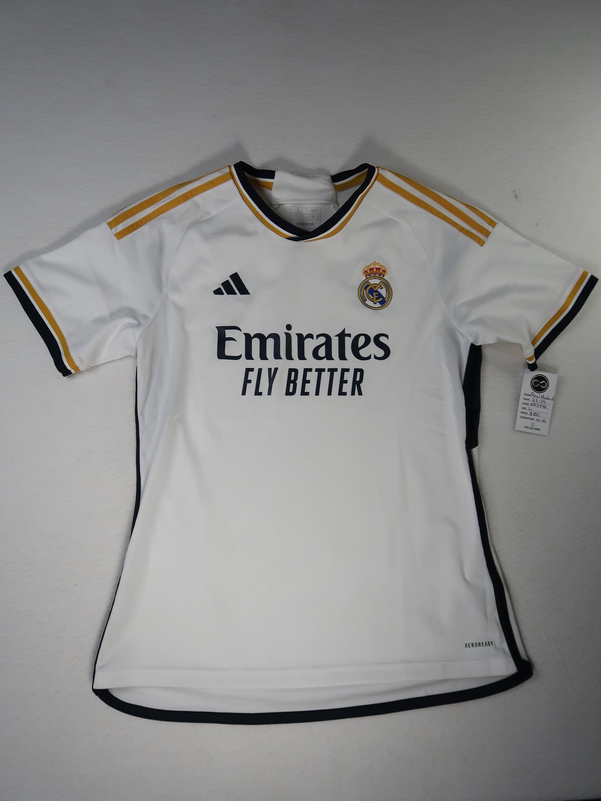 2023-24 Real Madrid home jersey front, white with navy and gold trim