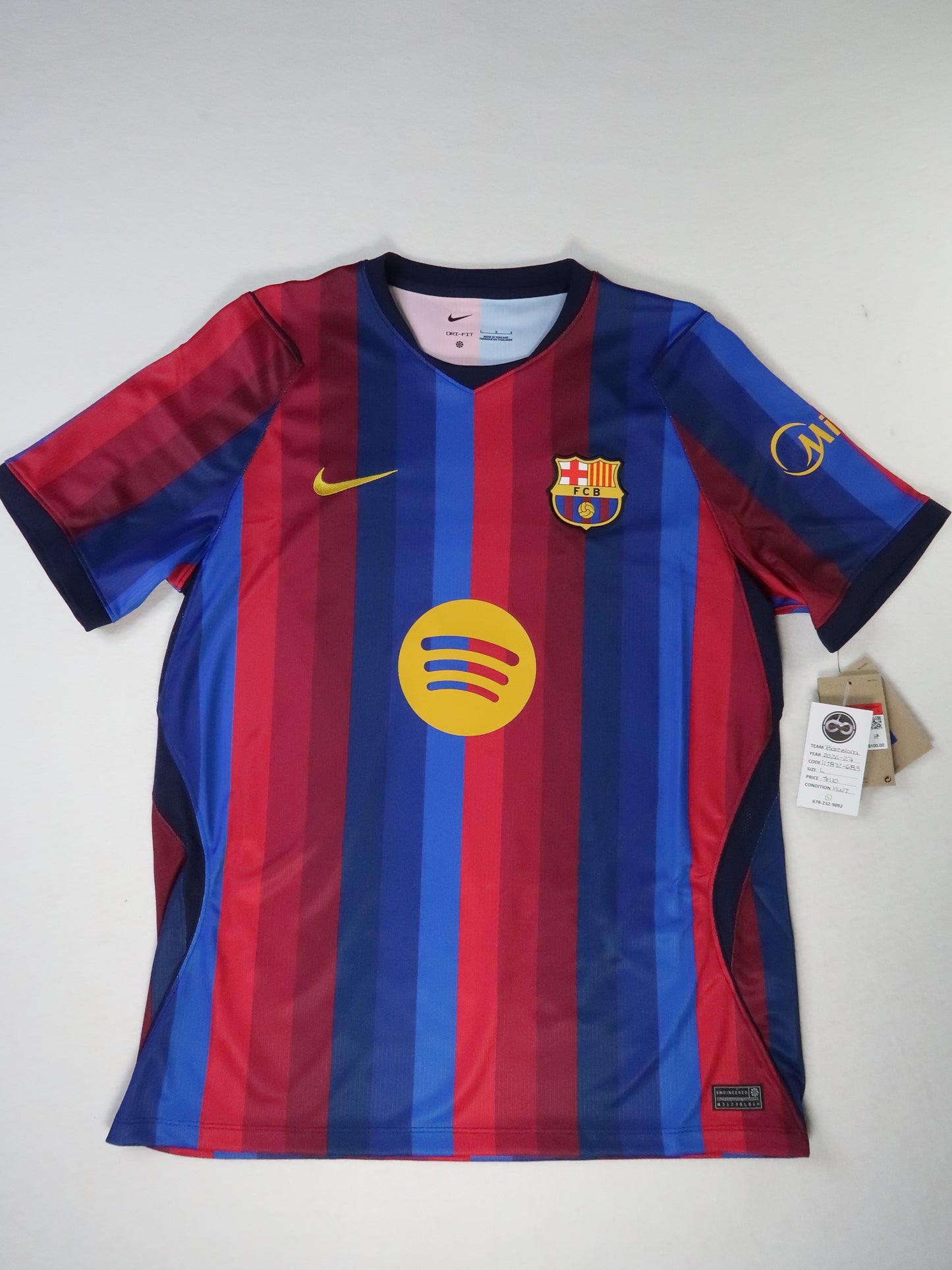2026-27 FC Barcelona away jersey front, multi-tone red and blue stripes