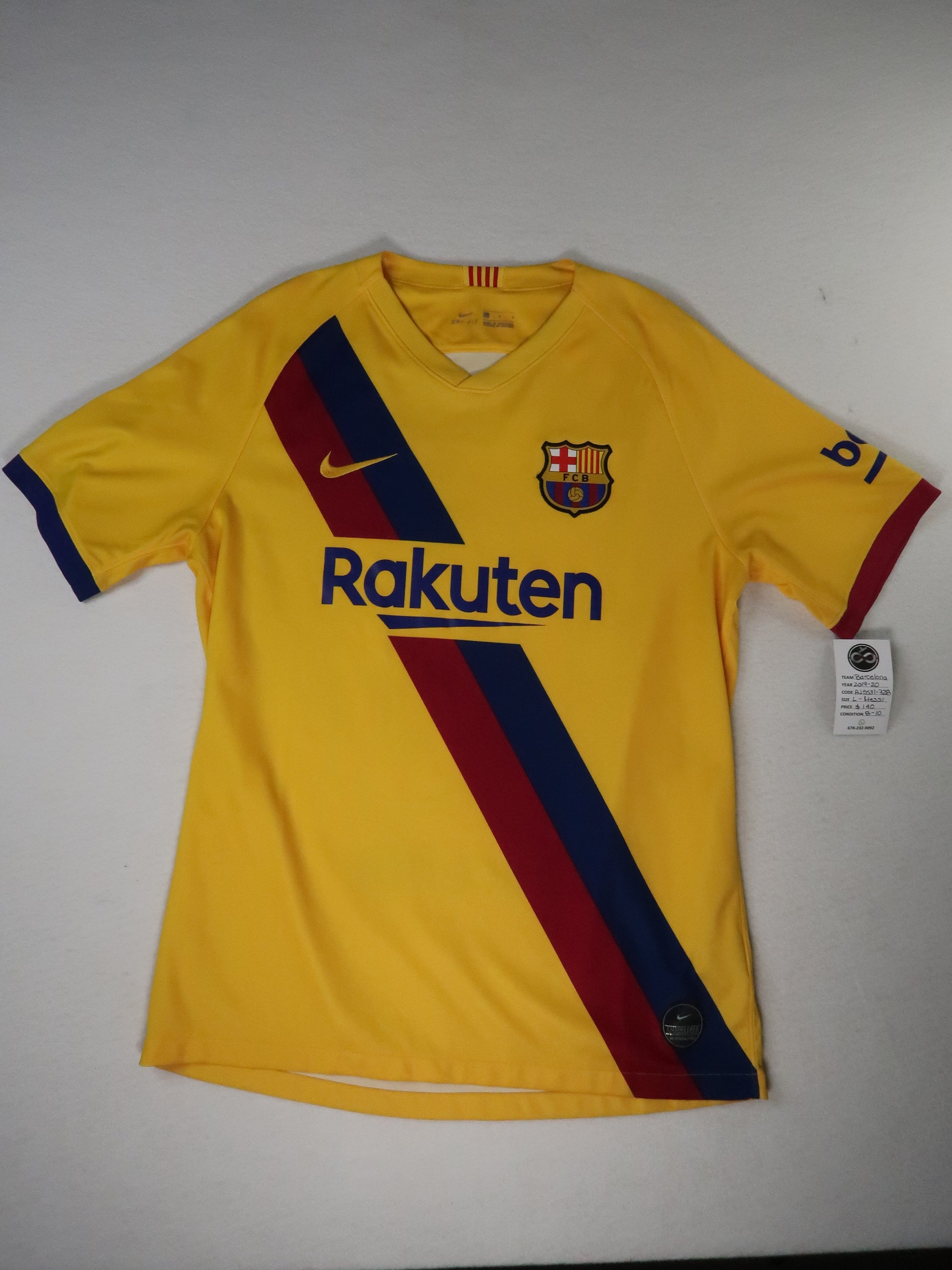 2019-20 FC Barcelona away jersey front, yellow with diagonal sash and Rakuten sponsor