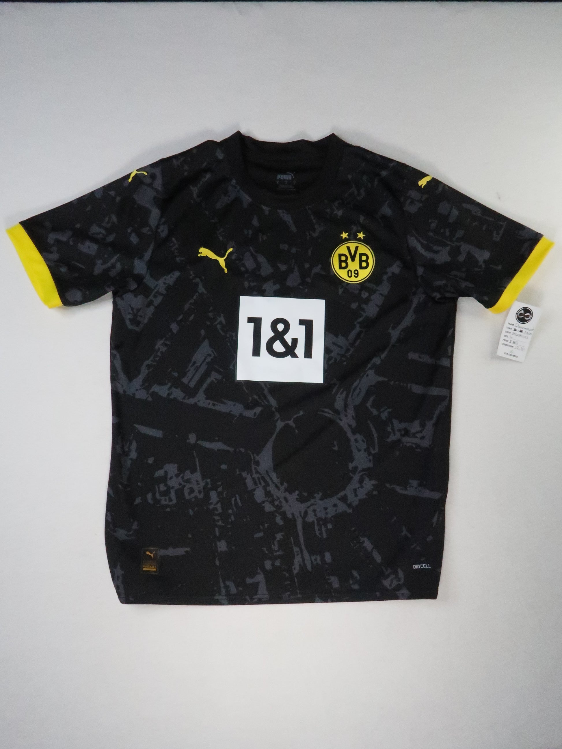 2023-24 Borussia Dortmund away jersey front, black camo pattern with 1&1 sponsor